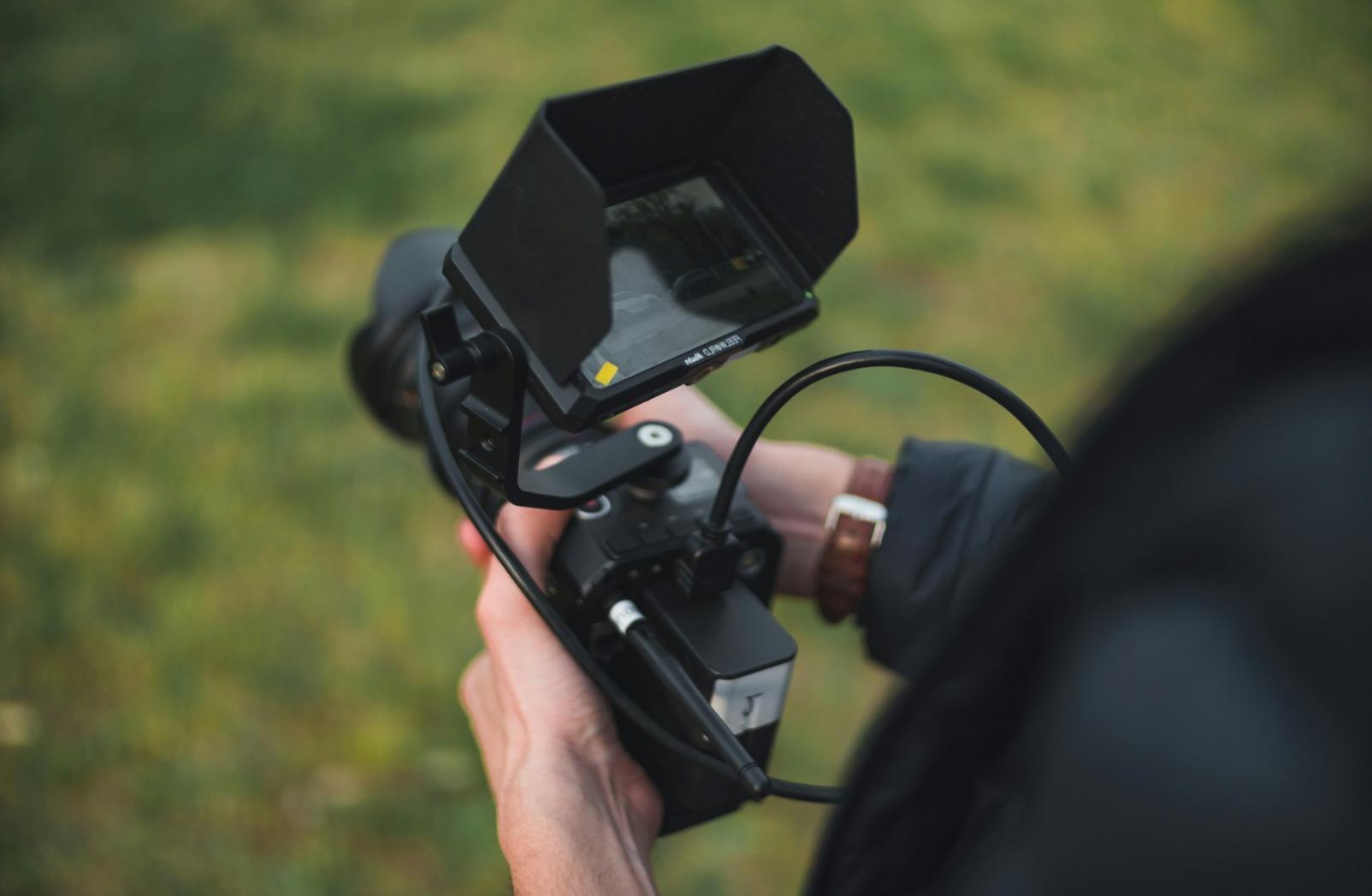 Video editing workspace with multiple monitors showing timeline
