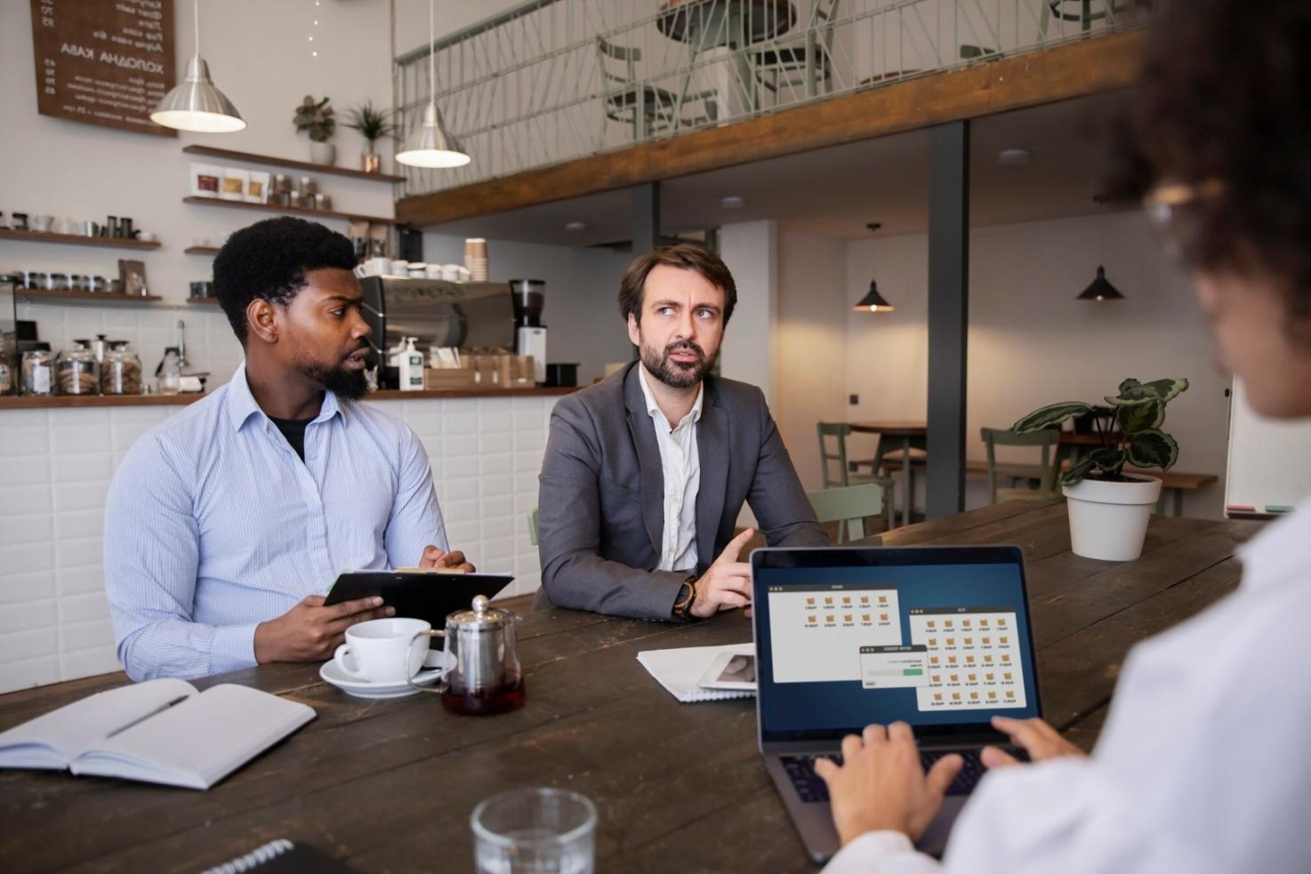 Video editing workspace with multiple monitors showing timeline and footage