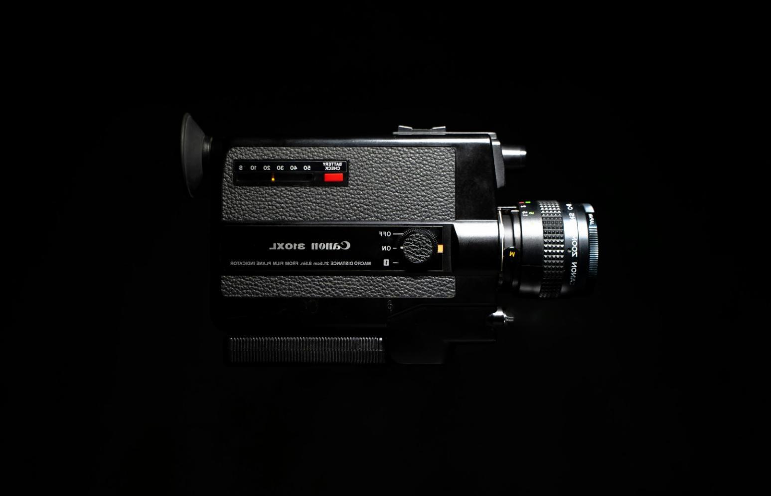 Students working on video editing projects in classroom setting