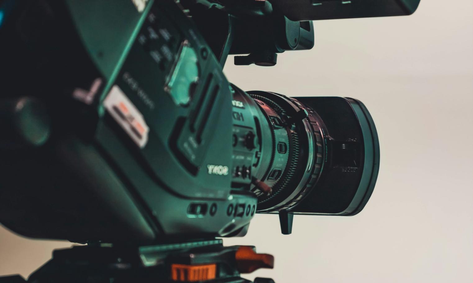 Video editing instructor reviewing project timeline with attention to detail